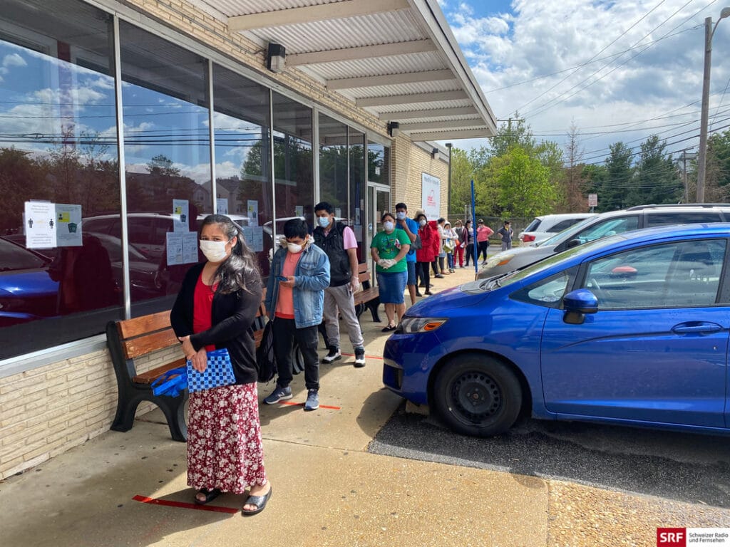 Local residents waiting in the line of the United Community food pantry during the covid-19 pandemic.