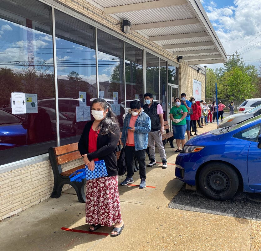 Local residents waiting in the line of the United Community food pantry during the covid-19 pandemic.