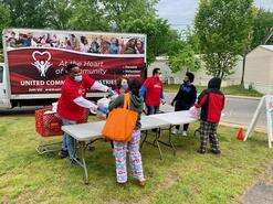 Staff handing out food from truck