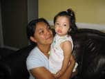 Mother holding daughter