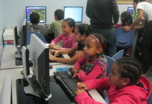 Youth studying in the Sacramento Neighborhood Computer Lab