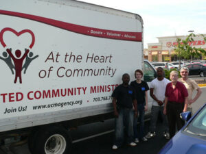 Staff and volunteers in front of the UCM food truck
