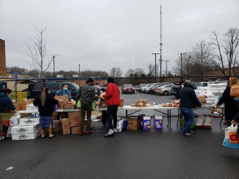 People at the family market at Mount Vernon Woods Elementary to pick up food and other donated items.