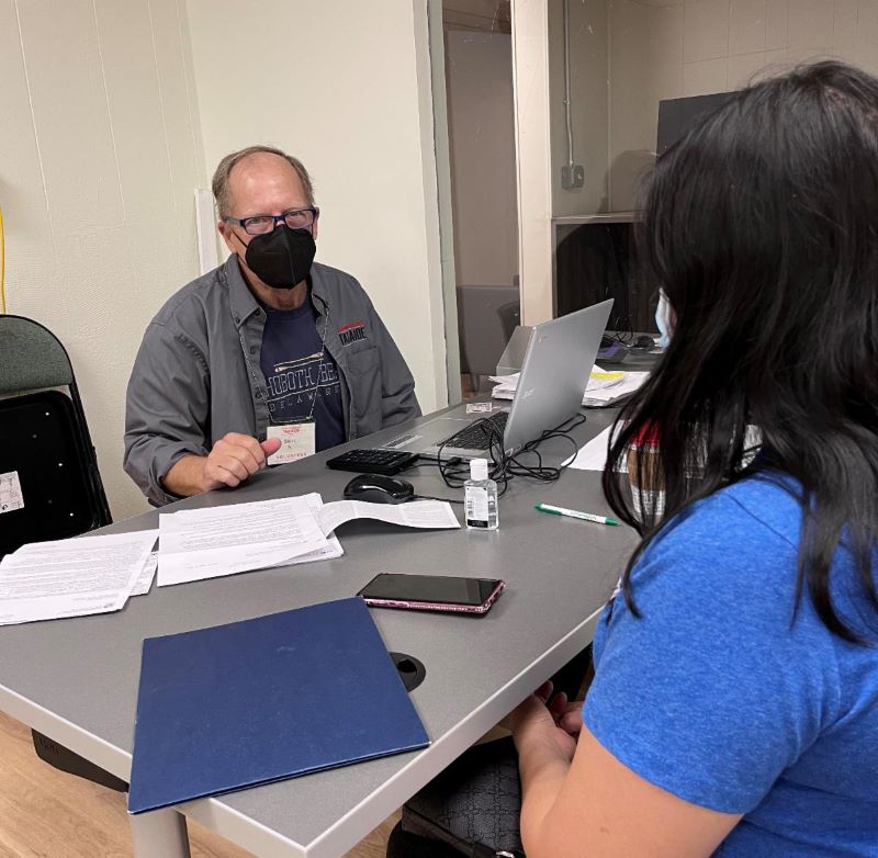 A tax assister and client working to finish her taxes