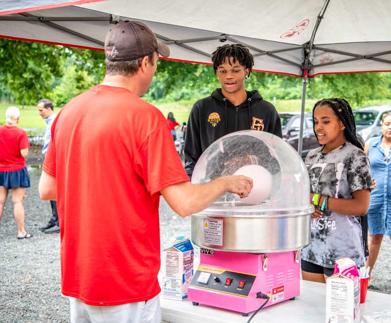 People getting cotton candy at our Family Fun Day