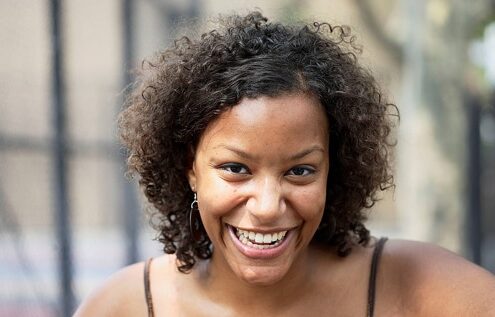 Smiling woman with curly hair